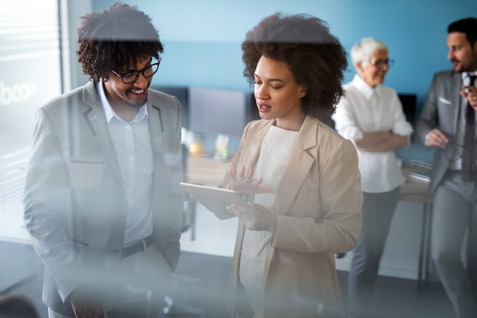 Portrait of successful business people working together in corporate office. Portrait of successful business people working together in corporate office. Business teamwork concept